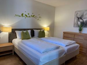 Ένα ή περισσότερα κρεβάτια σε δωμάτιο στο Hapimag Ferienwohnungen Unterkirnach