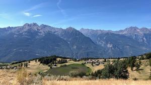 a view of a mountain range with a field and mountains at Casa Luigina in Verrayes +79 photos