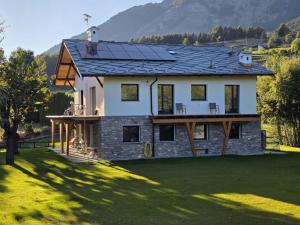 a house with solar panels on the roof at Casa Luigina in Verrayes