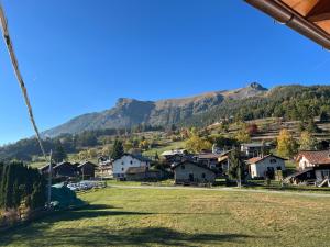 a view of a village with a mountain in the background at Casa Luigina in Verrayes