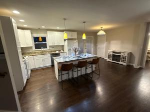 a kitchen with a table and chairs in a room at Arboretum house in Glen Ellyn