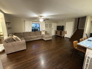 a living room with a couch and a table at Arboretum house in Glen Ellyn