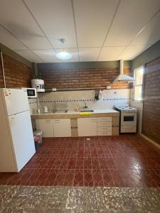 Kuchyň nebo kuchyňský kout v ubytování Alojamiento cuyum