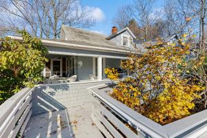 a house with two large planters in front of it at Ledgewood 7 in Seal Harbor