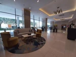 a lobby with a couch and chairs and a table at Seaview Apartment with Pool at Lapu-Lapu City in Punta Engaño +29 photos