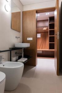 a bathroom with a white tub and a sink at Dal Console Rooms in Naples +81 photos