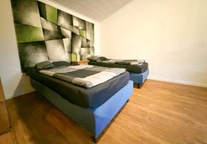 Ένα ή περισσότερα κρεβάτια σε δωμάτιο στο Modern appartement voor 2 personen In Friedeburg - 79-5 +5 φωτογραφίες