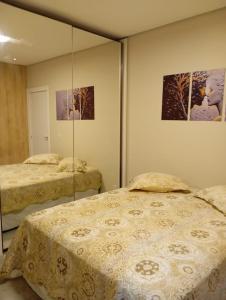 Postel nebo postele na pokoji v ubytování Winter X Locações 02