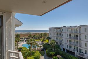 a view of the beach from the balcony of a condo at Beach Club #414 in Saint Simons Island