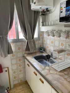 Kuchyň nebo kuchyňský kout v ubytování Toninas Relax + 30 fotografií