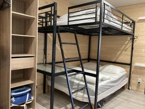 a bunk bed room with two bunk beds at Cocon montagne Rocher du Cerf in Le Lioran