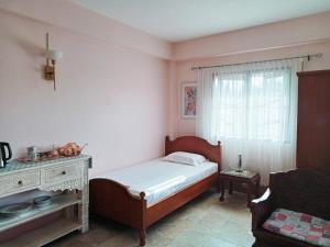 Postel nebo postele na pokoji v ubytování Homestay PJ Garden Home