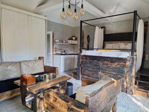 a living room with a couch and a bunk bed at Apartment Mia in Vrnjačka Banja