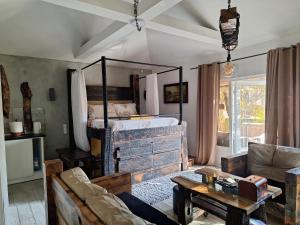 a living room with a bed and a couch at Apartment Mia in Vrnjačka Banja