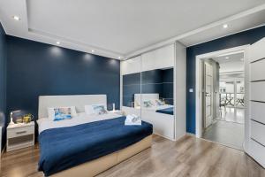 Postel nebo postele na pokoji v ubytování DreamHouse Apartament Zefir Północna 18B, Darłówko Wschodnie