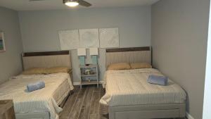 a room with two beds in a room at Oceanfront Retreat Private Beach New Smyrna Beach in New Smyrna Beach +17 photos