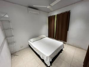 Postel nebo postele na pokoji v ubytování Casa playa + 1 fotografie