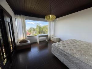 Postel nebo postele na pokoji v ubytování Temporada de Casa apenas 500 metros da Praia da Gamboa SC