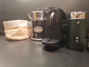 a blackffeepot sitting on top of a counter at Strumpfburg by Dollop Living in Kramsach