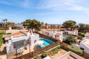an aerial view of a house with a swimming pool at Villa Iris Prima by Villa Plus in Punta Prima