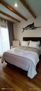 Ένα ή περισσότερα κρεβάτια σε δωμάτιο στο Hospedaje Vientos