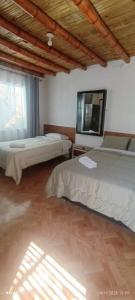 Ένα ή περισσότερα κρεβάτια σε δωμάτιο στο Hospedaje Vientos +7 φωτογραφίες