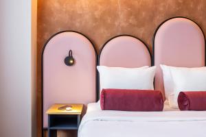 Ένα ή περισσότερα κρεβάτια σε δωμάτιο στο Hotel des Colonies Brussels by Mercure