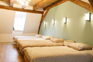 Ένα ή περισσότερα κρεβάτια σε δωμάτιο στο Le 101 d'Alsaciens