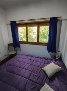 En eller flere senge i et værelse på Departamento céntrico