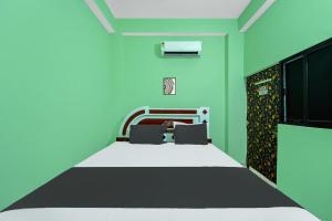 Ένα ή περισσότερα κρεβάτια σε δωμάτιο στο Hotel O Luxury +20 φωτογραφίες