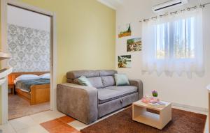 a living room with a couch and a bed at Villa Mir - Rovinj by Villas Guide in Štanga