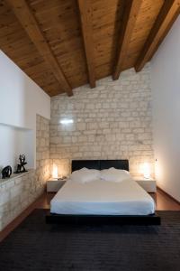 Postel nebo postele na pokoji v ubytování Pietre Nere Resort & Spa