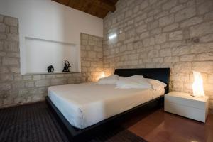 Postel nebo postele na pokoji v ubytování Pietre Nere Resort & Spa