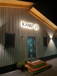 a building with a sign that reads krank at Kamp 27 in Bebertal Zwei
