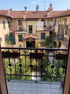 a balcony with a view of a courtyard at Casaldo in Gardone Riviera +16 photos