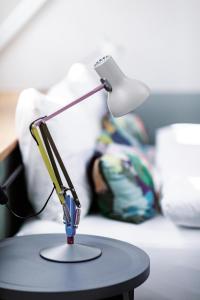 Ένα ή περισσότερα κρεβάτια σε δωμάτιο στο Sorell Boutique-Hotel City Weissenstein St Gallen