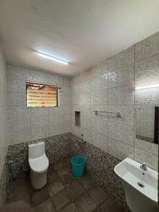 a bathroom with a toilet and a sink at Nirvikalpa vagamon in Vagamon