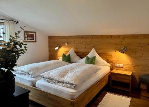 En eller flere senge i et værelse på Ferienwohnung Malerlehen