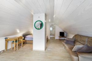 a living room with a couch and a table at Haus Waldesruh in Medebach