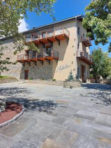 a building with balconies on the side of it at L'Autentic in Aussois