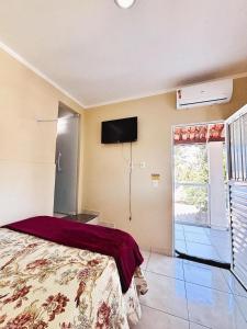 Postel nebo postele na pokoji v ubytování Pousada Três Praias