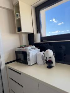 Η κουζίνα ή μικρή κουζίνα στο TM Panoramic apartament centru Iași Piața Unirii +11 φωτογραφίες