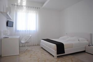 Postel nebo postele na pokoji v ubytování Pietre Nere Resort & Spa