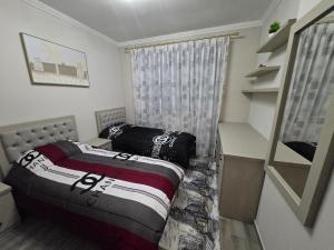 Una cama o camas en una habitación de Home sweet Home apartment's