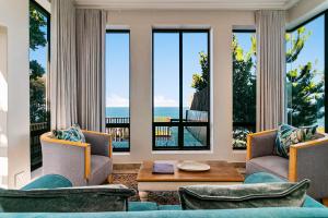 a living room with a view of the ocean at Knysna, Pezula Golf Estate in Knysna