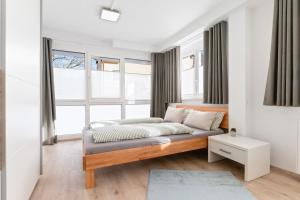 Postel nebo postele na pokoji v ubytování Helle & ruhige Eigentumswohnung nahe A81