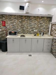 Kuchyň nebo kuchyňský kout v ubytování منتجع الكناري