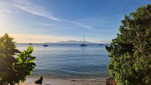 a view of the ocean with boats in the water at KazCoco Marie-Galante in Saint-Louis +13 photos
