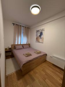 Giường trong phòng chung tại Fagus apartments