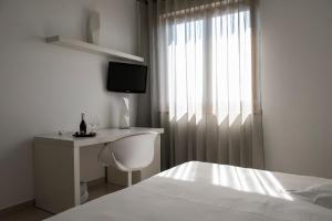Postel nebo postele na pokoji v ubytování Pietre Nere Resort & Spa